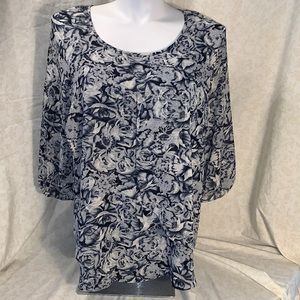 Krazy Kat floral blouse with 3/4 length sleeves.